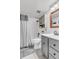 Updated bathroom with shower-tub combo and modern vanity and fixture at 505 S Roosevelt Rd, Lafayette, CO 80026