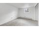 Neutral bedroom with carpet and a small window providing natural light at 505 S Roosevelt Rd, Lafayette, CO 80026