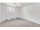 Empty room with carpet, white walls and a small window providing natural light at 505 S Roosevelt Rd, Lafayette, CO 80026