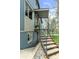 Side view of home showcasing updated exterior, metal railing, and easy access to the front entrance at 505 S Roosevelt Rd, Lafayette, CO 80026