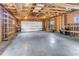 Large unfinished garage with exposed beams and ample storage space at 505 S Roosevelt Rd, Lafayette, CO 80026