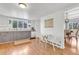 Bright kitchen with updated cabinets, white countertops, and views to the dining area, perfect for casual meals at 505 S Roosevelt Rd, Lafayette, CO 80026