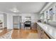 Well-lit kitchen with stainless steel appliances, ample counter space, and charming details for a modern culinary experience at 505 S Roosevelt Rd, Lafayette, CO 80026
