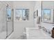 Elegant bathroom featuring marble vanity and a glass shower at 536 W Caley Cir, Littleton, CO 80120