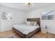 Spacious bedroom with wood flooring and large window at 536 W Caley Cir, Littleton, CO 80120