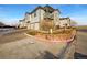 Condo building with attached garage and landscaping at 10381 Cook Way # 205, Thornton, CO 80229