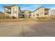 Attractive exterior of a two-story townhome with stone accents and balconies at 10381 Cook Way # 205, Thornton, CO 80229