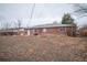 Brick home in its backyard environment shows an area for outdoor enjoyment and relaxation at 840 Tucson St, Aurora, CO 80011