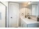 Bright bathroom features a walk-in shower and a modern vanity with a decorative faucet at 840 Tucson St, Aurora, CO 80011