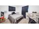 Cozy bedroom features neutral carpet and walls with natural light from the covered window at 840 Tucson St, Aurora, CO 80011