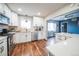 Well-equipped kitchen with stainless appliances, white subway tile backsplash and modern countertop at 840 Tucson St, Aurora, CO 80011