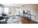 Cozy living room featuring hardwood floors, a modern TV setup, and comfortable seating, perfect for relaxation at 840 Tucson St, Aurora, CO 80011