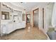 Bright bathroom with double vanity, mirrors, and spacious walk-in shower at 1175 Ridge Oaks Dr, Castle Rock, CO 80104