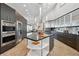 Gourmet kitchen with stainless steel appliances, granite counters, and a spacious center island at 1175 Ridge Oaks Dr, Castle Rock, CO 80104
