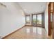 Bright living room with granite flooring, balcony access, and scenic views at 1175 Ridge Oaks Dr, Castle Rock, CO 80104