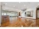 Bright living room features hardwood floors, bar area, and sliding doors to the outside at 1175 Ridge Oaks Dr, Castle Rock, CO 80104