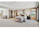 Spacious main bedroom with sitting area, deck access, and walk-in closet at 1175 Ridge Oaks Dr, Castle Rock, CO 80104