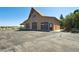 Outbuilding with multiple garage doors and driveway at 1175 Ridge Oaks Dr, Castle Rock, CO 80104