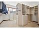 Well-organized walk-in closet with custom shelving and storage solutions at 1175 Ridge Oaks Dr, Castle Rock, CO 80104