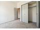 Bedroom with a large closet and neutral carpeting at 6544 Alkire Ct, Arvada, CO 80004