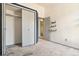 Bedroom features neutral carpeting and closet with sliding doors at 6544 Alkire Ct, Arvada, CO 80004