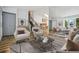 Bright living room with stylish furniture and staircase access, creating a welcoming and functional space at 6544 Alkire Ct, Arvada, CO 80004