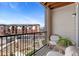 Relaxing balcony view with outdoor seating and view of the community landscaping on a sunny day at 14341 E Tennessee Ave # 203, Aurora, CO 80012