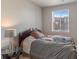 Comfortable bedroom featuring a serene atmosphere with a large window for natural light at 14341 E Tennessee Ave # 203, Aurora, CO 80012