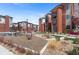 A view of the community park with playground, seating, and well-kept landscaping at 14341 E Tennessee Ave # 203, Aurora, CO 80012