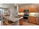 Well-equipped kitchen featuring granite countertops, stainless steel appliances, and ample cabinet space at 14341 E Tennessee Ave # 203, Aurora, CO 80012