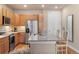 Island in kitchen with granite countertops, stainless appliances, and a breakfast bar with stool seating at 14341 E Tennessee Ave # 203, Aurora, CO 80012