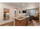 Modern kitchen with stainless steel appliances, granite countertops, and an open layout to the living area at 14341 E Tennessee Ave # 203, Aurora, CO 80012