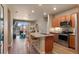 Stylish kitchen with granite countertops and seating area overlooking the living room and balcony at 14341 E Tennessee Ave # 203, Aurora, CO 80012