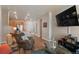 Cozy living room featuring wood floors, comfortable leather furniture and a flat screen TV at 14341 E Tennessee Ave # 203, Aurora, CO 80012