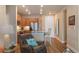 Open-concept living area flowing into a modern kitchen with stainless appliances and ample seating at 14341 E Tennessee Ave # 203, Aurora, CO 80012