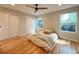 Inviting bedroom with hardwood floors, dual closets, and ample natural light at 18073 E Belleview Pl, Centennial, CO 80015
