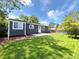 Exterior view of the home and back yard, showcasing the lawn and patio space at 18073 E Belleview Pl, Centennial, CO 80015