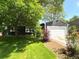 Charming home featuring a well-maintained lawn, mature trees, and a two-car garage at 18073 E Belleview Pl, Centennial, CO 80015