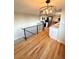 Bright open floor plan with hardwood floors, stainless steel appliances, and modern lighting at 18073 E Belleview Pl, Centennial, CO 80015
