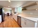 Contemporary kitchen featuring stainless steel appliances and wood shelving at 18073 E Belleview Pl, Centennial, CO 80015