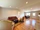 Spacious living room featuring hardwood floors, fireplace, and abundant natural light at 18073 E Belleview Pl, Centennial, CO 80015