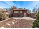 Backyard with pavers and mulch, exterior door, and fenced perimeter at 1601 Jackson St, Denver, CO 80206