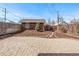 Backyard with pavers, decorative stone walkway and garden space with mulch at 1601 Jackson St, Denver, CO 80206