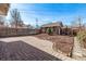 Paver patio and wood fencing with decorative mulch and stone features at 1601 Jackson St, Denver, CO 80206