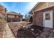 Pavers and mulch landscaping in backyard with exterior building at 1601 Jackson St, Denver, CO 80206