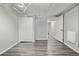 Spacious basement area with wood-look floors, open doorway, and plenty of room for activities at 1601 Jackson St, Denver, CO 80206