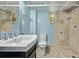 Stylish bathroom featuring a tiled walk-in shower and elegant fixtures at 1601 Jackson St, Denver, CO 80206