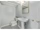 Quaint bathroom with pedestal sink, tiled floor, and classic fixtures at 1601 Jackson St, Denver, CO 80206