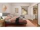 Cozy bedroom features a comfortable bed, soft lighting, and hardwood floors at 1601 Jackson St, Denver, CO 80206