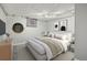 Modern bedroom with neutral tones, stylish decor, and a comfortable bed at 1601 Jackson St, Denver, CO 80206